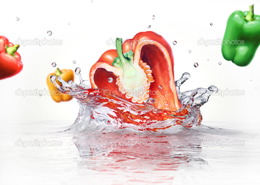 Sweet bell peppers multicolors falling and splashing into clear 