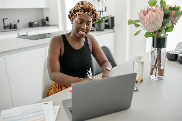 African Woman Working Home Going Paperwork Writing Notes Laptop Smartphone — Stock Fotó