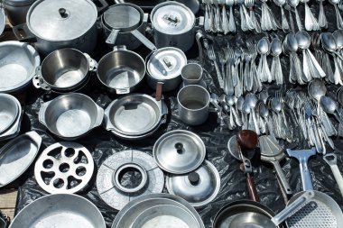 aluminum cookware for sale at a flea market