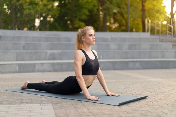 Fitness Woman Practice Yoga Exercises Mat Outdoor City Street Sunlight — стокове фото