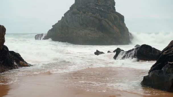 Ocean wild beach stormy weather. Praia da Adraga sandy beach with picturesque landscape background, Sintra Cascais, Portugal — ストック動画