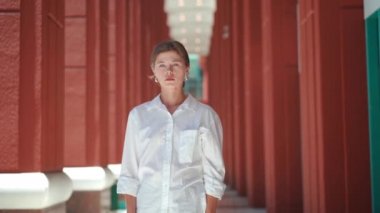 Businesswoman showing stop gesture by palm hand. Rejecting Offer, Denying, Stopping , Sign of Stop ,Not interested. Caucasian female business person standing outdoor in white shirt show stop sign 