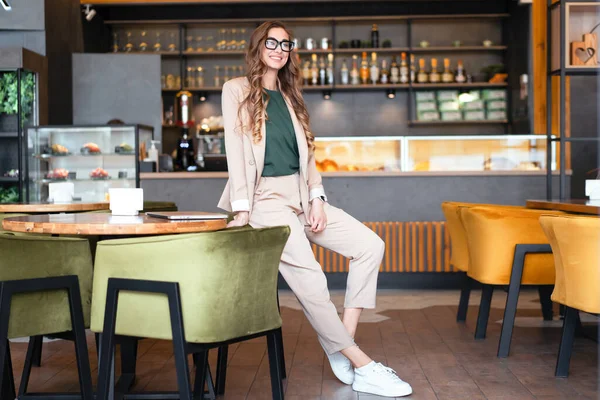 Business Woman Restaurant Owner Dressed Elegant Pantsuit Standing In Restaurant With Bar Counter Background Caucasian Female Glasses Business Person Indoor hands in pockets full lengthfull lengt