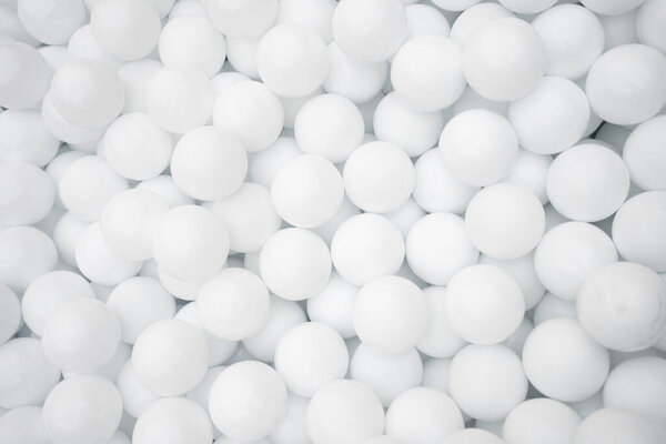 Many white plastic balls for dry pool in amusement park