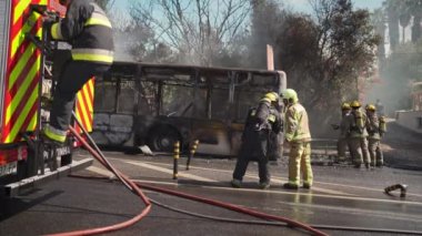 Portugal, Odivelas 07 September 2022 Rescue Team of Firefighters Arrive on the Car Crash fired passenger bus Traffic Accident Scene. Firemen fire department fight with fire on road. Accident disaster