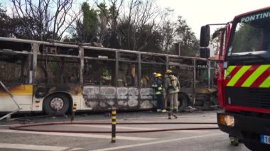 Portugal, Odivelas 07 September 2022 Rescue Team of Firefighters Arrive on the Car Crash fired passenger bus Traffic Accident Scene. Firemen fire department fight with fire on road. Accident disaster