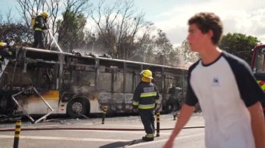 Portugal, Odivelas 07 September 2022 Rescue Team of Firefighters Arrive on the Car Crash fired passenger bus Traffic Accident Scene. Firemen fire department fight with fire on road. Accident disaster