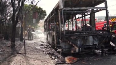 Portugal, Odivelas 07 September 2022 Rescue Team of Firefighters Arrive on the Car Crash fired passenger bus Traffic Accident Scene. Firemen fire department fight with fire on road. Accident disaster