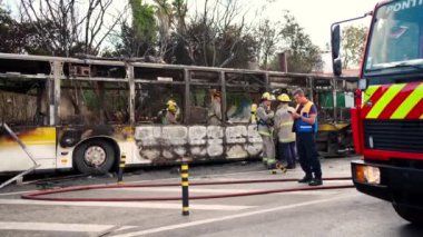 Portugal, Odivelas 07 September 2022 Rescue Team of Firefighters Arrive on the Car Crash fired passenger bus Traffic Accident Scene. Firemen fire department fight with fire on road. Accident disaster