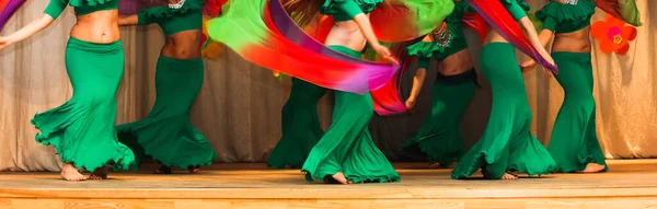 Women Dancers Legs Motion Dance Colorful Gorgeous Costumes Stage Focus — Zdjęcie stockowe