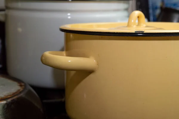 Large yellow enameled saucepan on the table — Stock Photo, Image