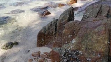 scene of granite boulders by the beach