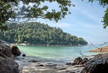 scene of granite boulders by the beach