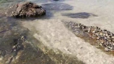 scene of granite boulders by the beach