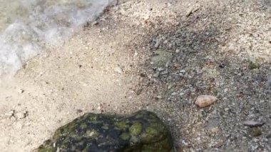 scene of granite boulders by the beach