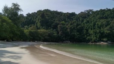 sunny day at the white sandy beach.