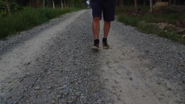 Walking Alone Rough Gravel Rural Road — Vídeo de Stock