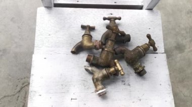 couple of antique brass faucets.
