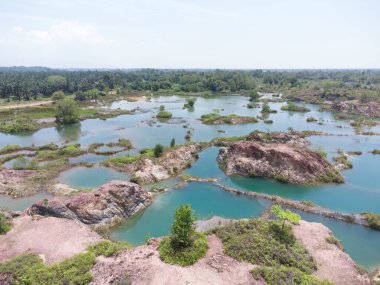 granite hill looking down to the abandoned mine ponds.