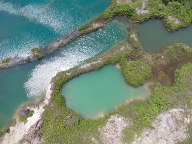 granite hill looking down to the abandoned mine ponds.
