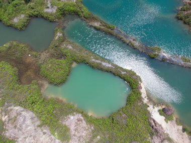 granite hill looking down to the abandoned mine ponds.