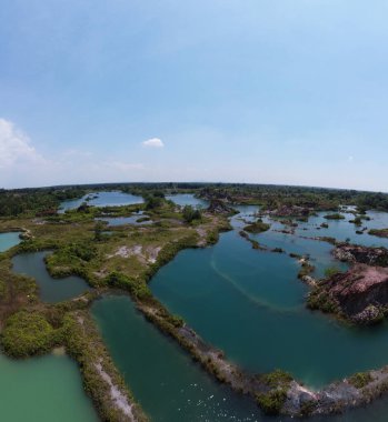 granite hill looking down to the abandoned mine ponds.