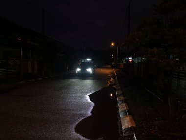 street scene at night after the rain