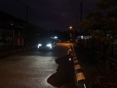 street scene at night after the rain
