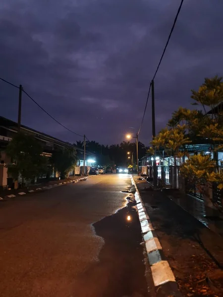 street scene at night after the rain