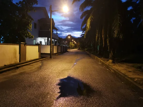 street scene at night after the rain