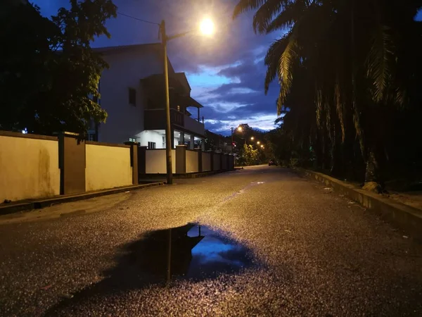 street scene at night after the rain