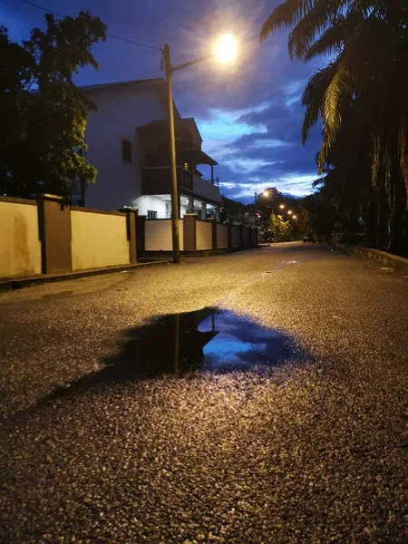 street scene at night after the rain