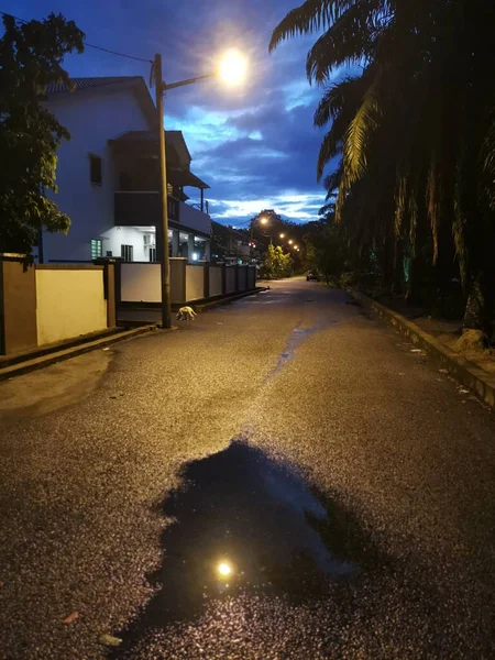 street scene at night after the rain