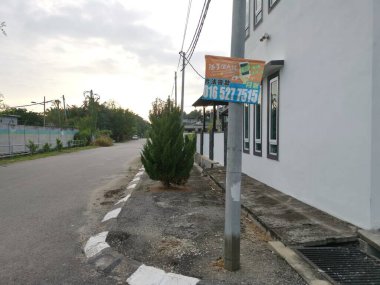 Perak,Malaysia.August 15,2022: Scene of loan placard advertisement along the roadside at Mas 1 residential Kg Koh street.