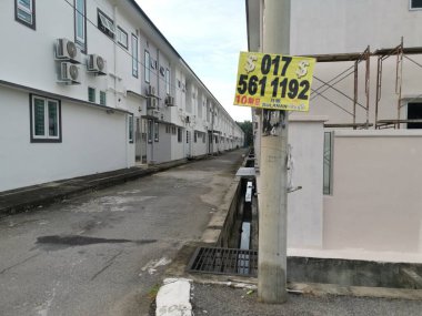 Perak,Malaysia.August 15,2022: Scene of loan placard advertisement along the roadside at Mas 1 residential Kg Koh street.