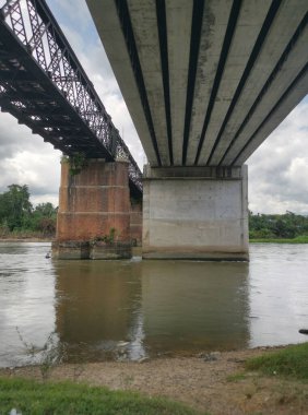 underneath the tall railway bridges.