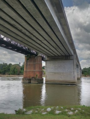 underneath the tall railway bridges.