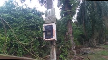 Signboards outside the entrance gate written in Malay and Mandarin languages prohibit trespass into the private property