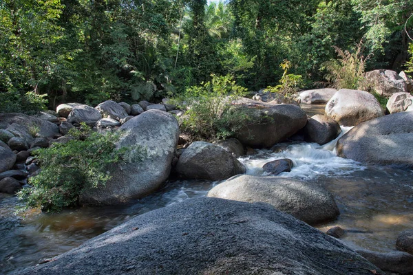 water flowing the rocky river stream in the forest.