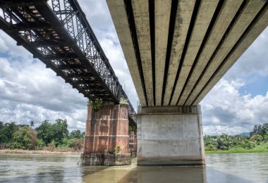 the tall railway bridge crossing the river.