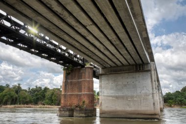the tall railway bridge crossing the river.