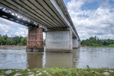 the tall railway bridge crossing the river.