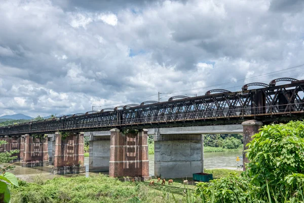 Tall Railway Bridge Crossing River — стоковое фото