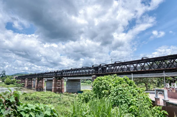 Tall Railway Bridge Crossing River — стоковое фото
