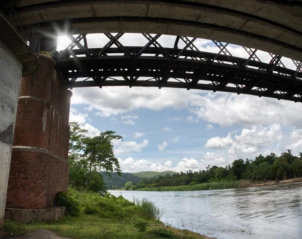 Tall Railway Bridge Crossing River — стоковое фото