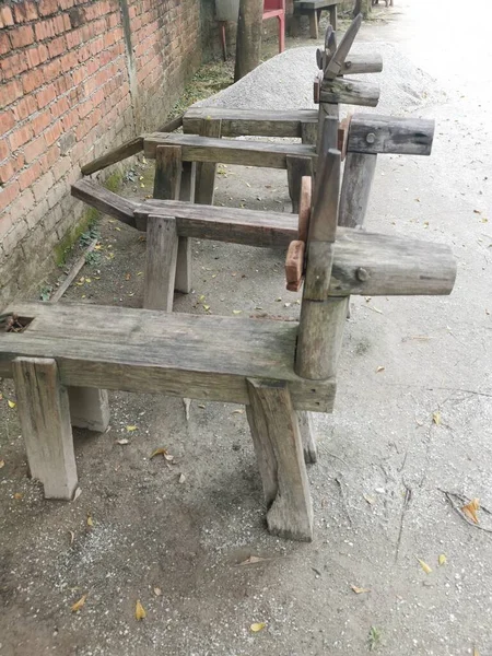 a row of wooden horse-shaped bench at the park