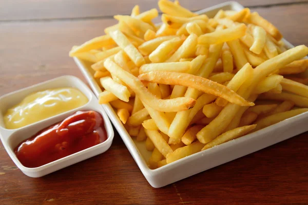 Golden French fries potatoes ready to be eaten — Stock Photo, Image