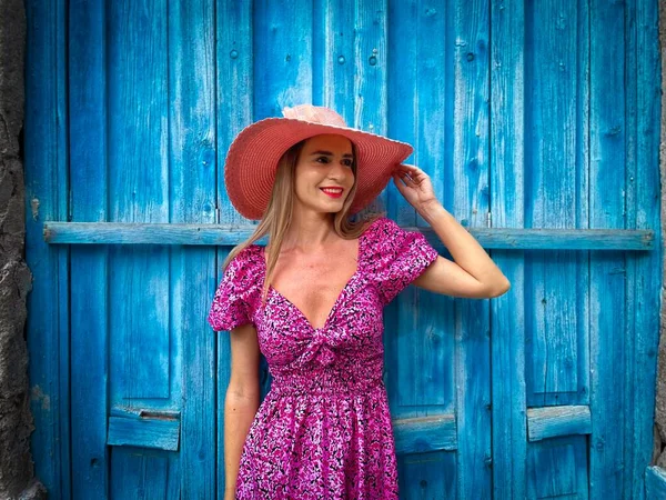 Young Blonde Woman Wearing Pink Dress Hat Standing Blue Wall — Stockfoto
