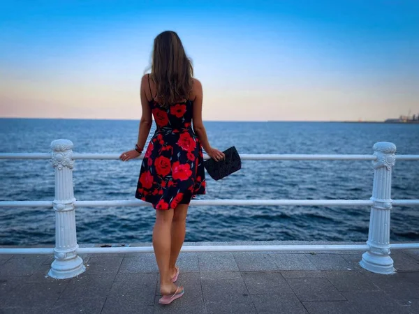 Woman Summer Dress Leaning Railing Sea Background Sunset — Stockfoto