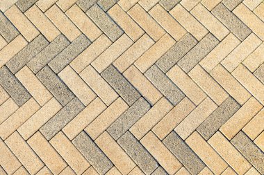 Gri ve sarı modern asfalt arka plan dokusu. İnce dikdörtgen şeklindeki kaldırım taşlarının yolu. Boşluğu kopyala